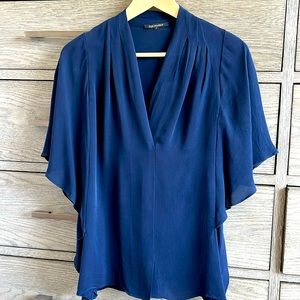 Navy flutter sleeve silk blouse